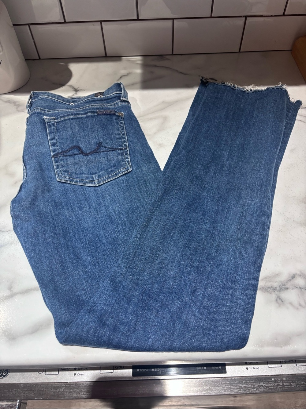 7 For All Mankind Medium Blue Flare Jeans with Raw Hem